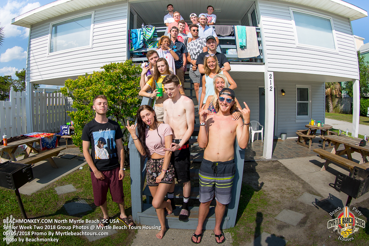 Senior Week group posing on the stairs of a North Myrtle Beach beach house