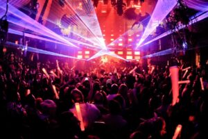 Laser light show over the crowd at a Senior Week party