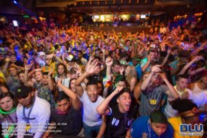 Crowd of grads dancing at a Myrtle Beach Senior Week theme party